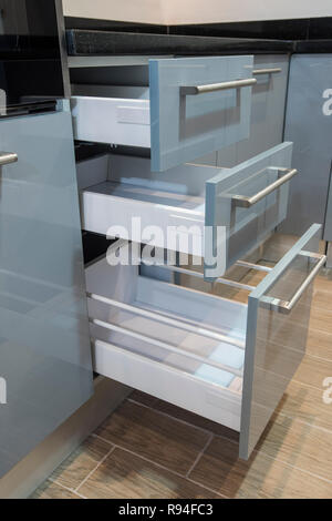 Interior design decor of kitchen in luxury apartment showing closeup detail of drawers Stock Photo