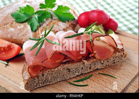 Sout tyrolean bacon on rye flat bread Stock Photo