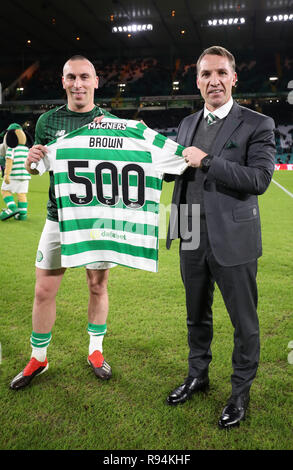 Celtic's Scott Brown is presented with a shirt from manager Brendan Rodgers for his 500th appearance for the club before the Ladbrokes Scottish Premiership match at Celtic Park, Glasgow. Stock Photo