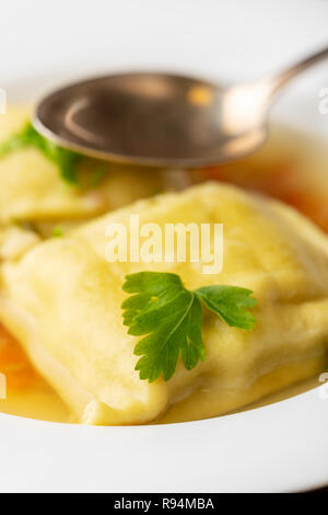 swabian maultasche in broth Stock Photo