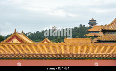 Jingshan Park in background with Wanchun Pavilion on top of Prospect Hill, Forbidden City rooftops in foreground, Beijing, China Stock Photo