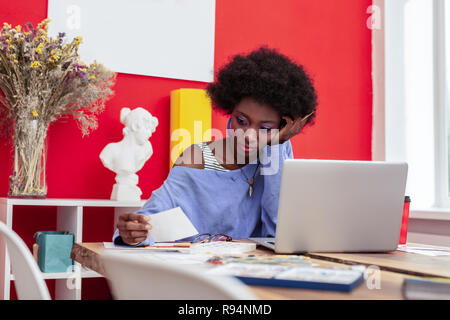 Interior designer feeling bored while working for too long Stock Photo