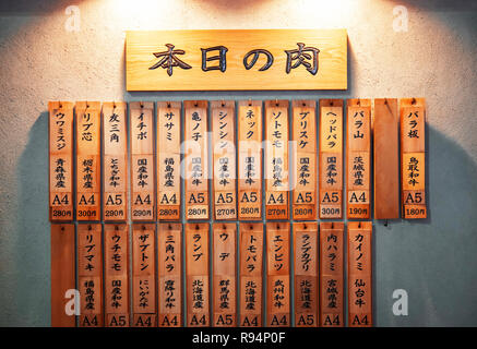 Traditional wooden sign with japanese letters at the village of ...