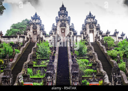 Three stone ladders in beautiful Pura Lempuyang Luhur temple. Summer landscape with stairs to temple. Paduraksa portals marking entrance Stock Photo