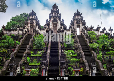 Three stone ladders in beautiful Pura Lempuyang Luhur temple. Summer landscape with stairs to temple. Paduraksa portals marking entrance Stock Photo