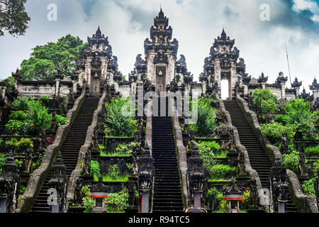 Three stone ladders in beautiful Pura Lempuyang Luhur temple. Summer landscape with stairs to temple. Paduraksa portals marking entrance Stock Photo