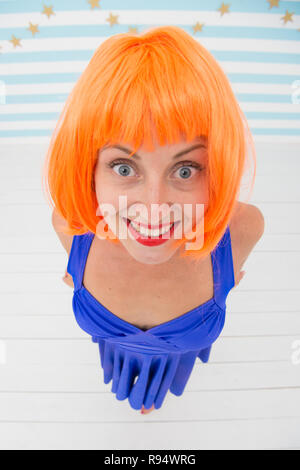 wow. it looks perfect. crazy girl looks incredible. wow look and positive emotions. what a nice surprise. orange hair of happy crazy girl. dont worry be happy Stock Photo