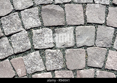 Small cobblestones laid in curve Stock Photo