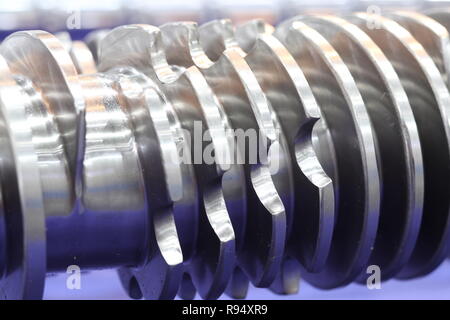 Screw press parts for plastic injection machine ; selective focus Stock Photo