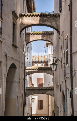 Buttresses over passage in historic center of Spoleto, Umbria, Italy Stock Photo