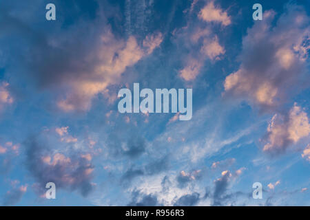 View of massive big Clouds on a colorful Sky. Stock Photo