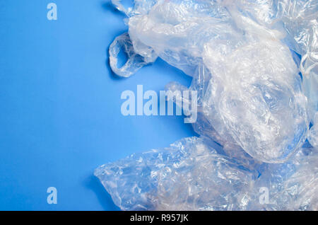 Plastic Bags on Blue Background, Recycle and Used Plastic Problem Concept Stock Photo