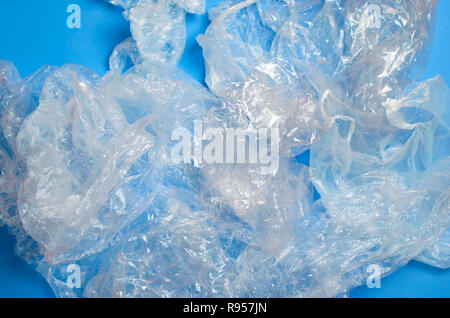 Plastic Bags on Blue Background, Recycle and Used Plastic Problem Concept Stock Photo