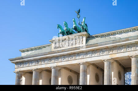 Brandenburg Gate In Berlin. Famous destination in Germany. Clear blue sky background. Stock Photo