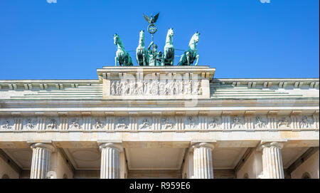 Brandenburg Gate In Berlin. Famous destination in Germany. Clear blue sky background. Stock Photo