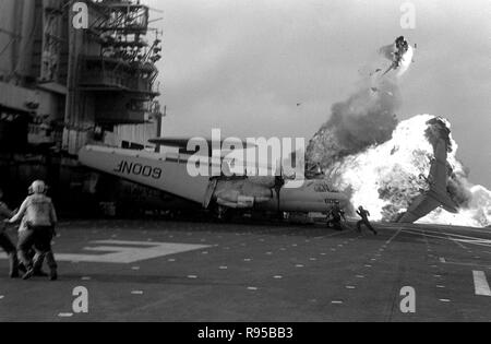 An Attack Squadron 56 (VA-56) A-7E Corsair aircraft bursts into flames after a ramp strike on the aircraft carrier USS MIDWAY (CV-41). US Navy photo. Stock Photo