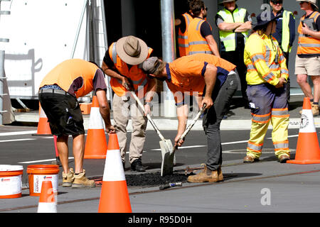 Construction workers building a light rail (tram) track in the CBD, Newcastle, NSW, Australia. Stock Photo