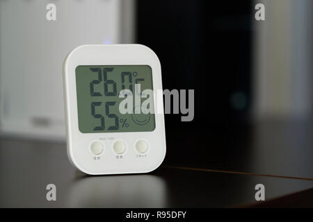 closeup  of Digital Indoor thermometer with humidity monitor Stock Photo