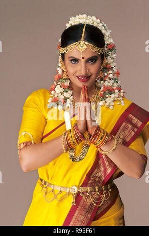 South Indian Bride , folded hands , namaste , wedding dress costume , marriage gold jewelry , India , Asia Stock Photo