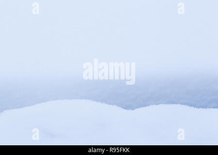 Full frame background of snow on the ground with little gap and shadow in the winter. Very simple and minimal abstract background. Stock Photo