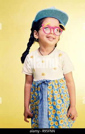 Girl child wearing funny glasses and cap Stock Photo