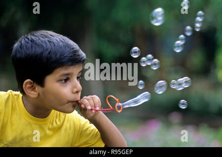 Boy blowing bubbles - MR#560 Stock Photo