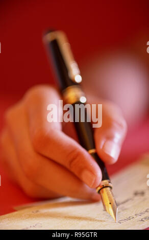 Writing with fountain pen Stock Photo