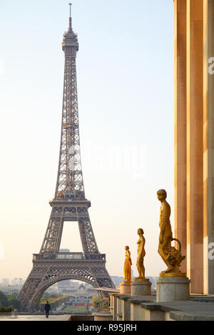 PARIS, FRANCE - JULY 7, 2018: Eiffel tower and man alone seen from Trocadero, clear summer morning in Paris, France Stock Photo