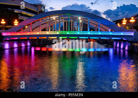 Elgin Bridge in Singapore, spanning the Singapore River near Boat Quay and Clarke Quay; lit up after sunset Stock Photo