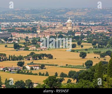Assisi, Perugia Province, Umbria, Italy. The Papal Basilica of Santa Maria degli Angelior Saint Mary of the Angels seen across the plain in front of Assisi. Stock Photo