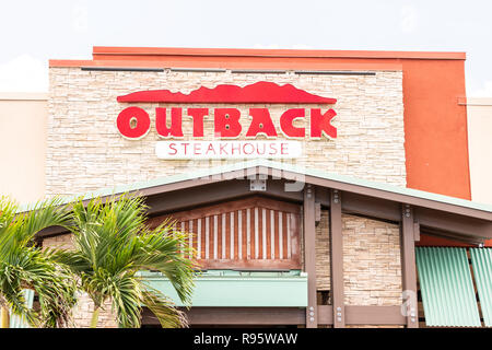 Key West, USA - May 1, 2018: Outback steakhouse restaurant with red sign, logo architecture, entrance, facade, business storefront in Florida keys, pa Stock Photo