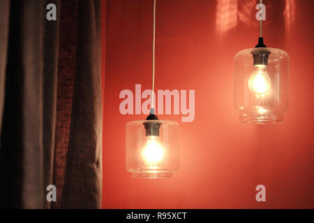 Group lamps in Coral interior with curtain. Color of the year 2019. Main trend concept. Stock Photo