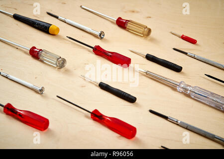 pattern background of various screwdrivers on  wooden work table Stock Photo