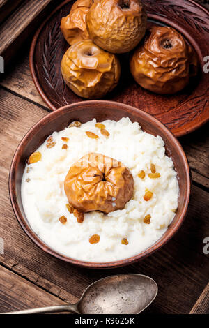 Traditional rice porridge on milk with apples Stock Photo