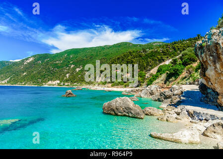 Blue clean water in Lefkada island, Petra beach in summertime, Greece Stock Photo