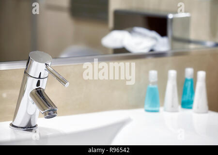 Hotel bathroom sink with tap, selective focus. Stock Photo