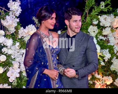 Indian actress Priyanka Chopra with her husband US musician Nick Jonas are seen during their wedding reception at the hotel JW Marriott in Mumbai. Stock Photo