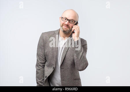 European mature man talking on the phone Stock Photo