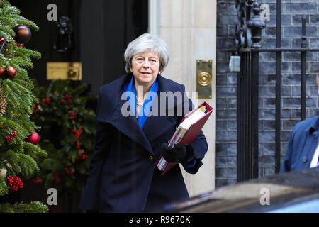 British Prime Minister Theresa May departs from Number 10 Downing Street to attend the final Prime Minister's Questions (PMQs)  of 2018 in the House of Commons with 100 day for Brexit. The United Kingdom will formally leave the European Union by 29 March 2019 and the UK Government has set aside £2 billion for a 'No Deal' Brexit. Stock Photo