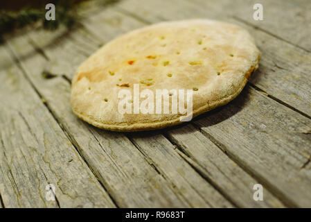 Pizza Calzone on old wooden table Stock Photo