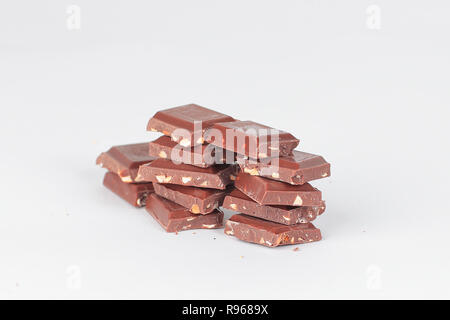 pieces of dark chocolate with nuts isolated on white.photo with  Stock Photo