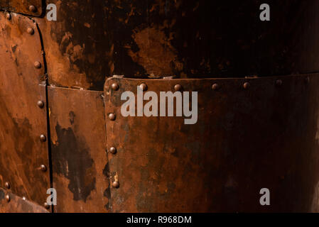 Rusted steel plates joined with rivets Stock Photo