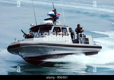 A patrol craft from Inshore Boat Unit 24 makes a hard turn to starboard as the crew conducts a security patrol in the waters near the Kuwait Naval Base DoD photo Stock Photo