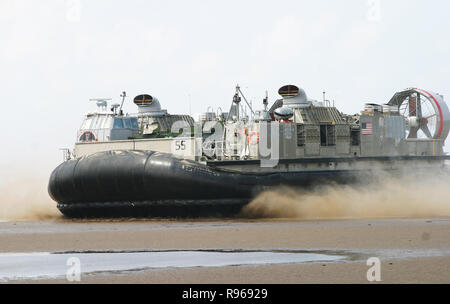 A U.S. Navy Landing Craft Air-Cushioned -LCAC- transports Marines of the 26th Marine Expeditionary Unit's (Special Operations Capable) Tactical Recovery of Aircraft Personnel Platoon onto the beach on the coast of Djibouti, Africa. DoD photo by Cpl. Eric R. Martin, U.S. Marine Corps Stock Photo