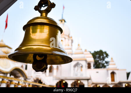 Ring bells in temple. Golden metal bell isolated. Big brass Buddhist bell of Japanese temple. Ringing bell in temple is belief auspicious. Bangkok, Th Stock Photo