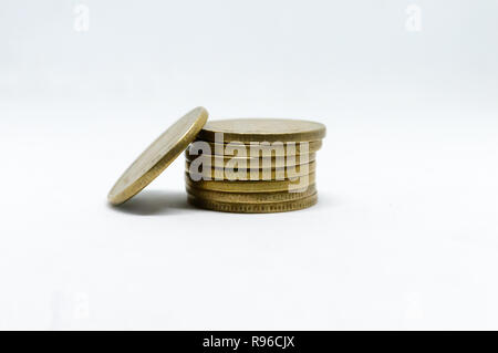 Stock pile of 5 Indian rupee metal coin currency on isolated white background. Financial, economy, investment concept. Banking and exchange object. cl Stock Photo