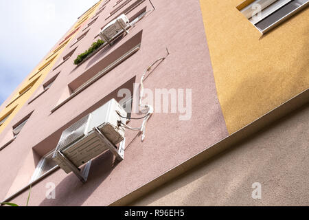 Air conditioning units fitted outside the wall of a large 10-story block of flats in Budapest, Hungary Stock Photo