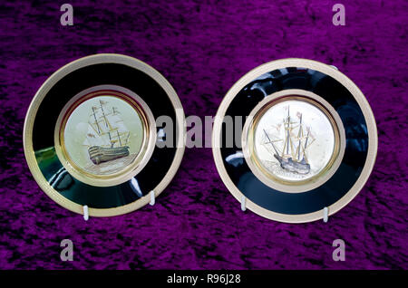 Chokin Decorative Plates Decorated with 24 Karat Gold Leaf depicting The Mayflower Ship & The HMS Victory Stock Photo