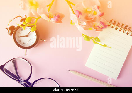 Black glasses and empty page notebook business woman schedule concept background Stock Photo