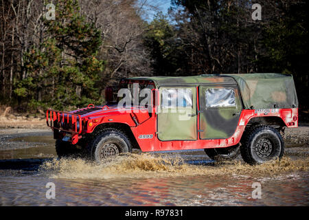 A Humvee from the Spring Lake Heights Fire Department is driven on the tactical driver's course on Joint Base McGuire-Dix-Lakehurst, N.J., Dec. 18, 2018. The Humvees were acquired by local police via the Law Enforcement Support Office (LESO) program at no cost. The vehicles are used for equipment transport, high-water rescue, and inclement weather. (U.S. Air National Guard photo by Master Sgt. Matt Hecht) Stock Photo